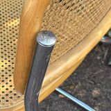 Wooden chair with caning in the style of Marcel Breuer.