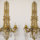 Two bronze and cut glass wall-mounted chandeliers