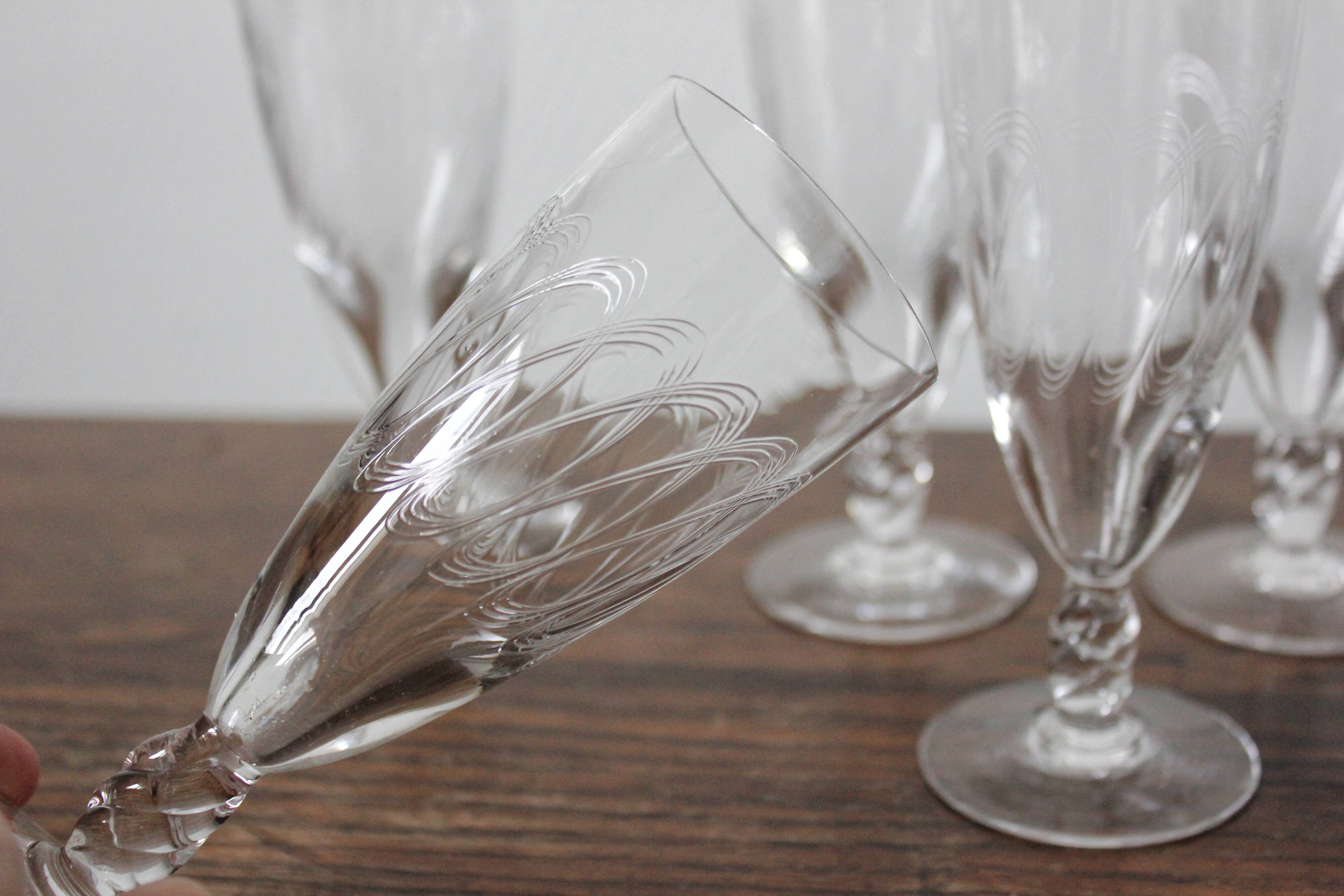 8 antique champagne flutes in engraved crystal and twisted foot