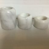 9 marble candle holders of different sizes