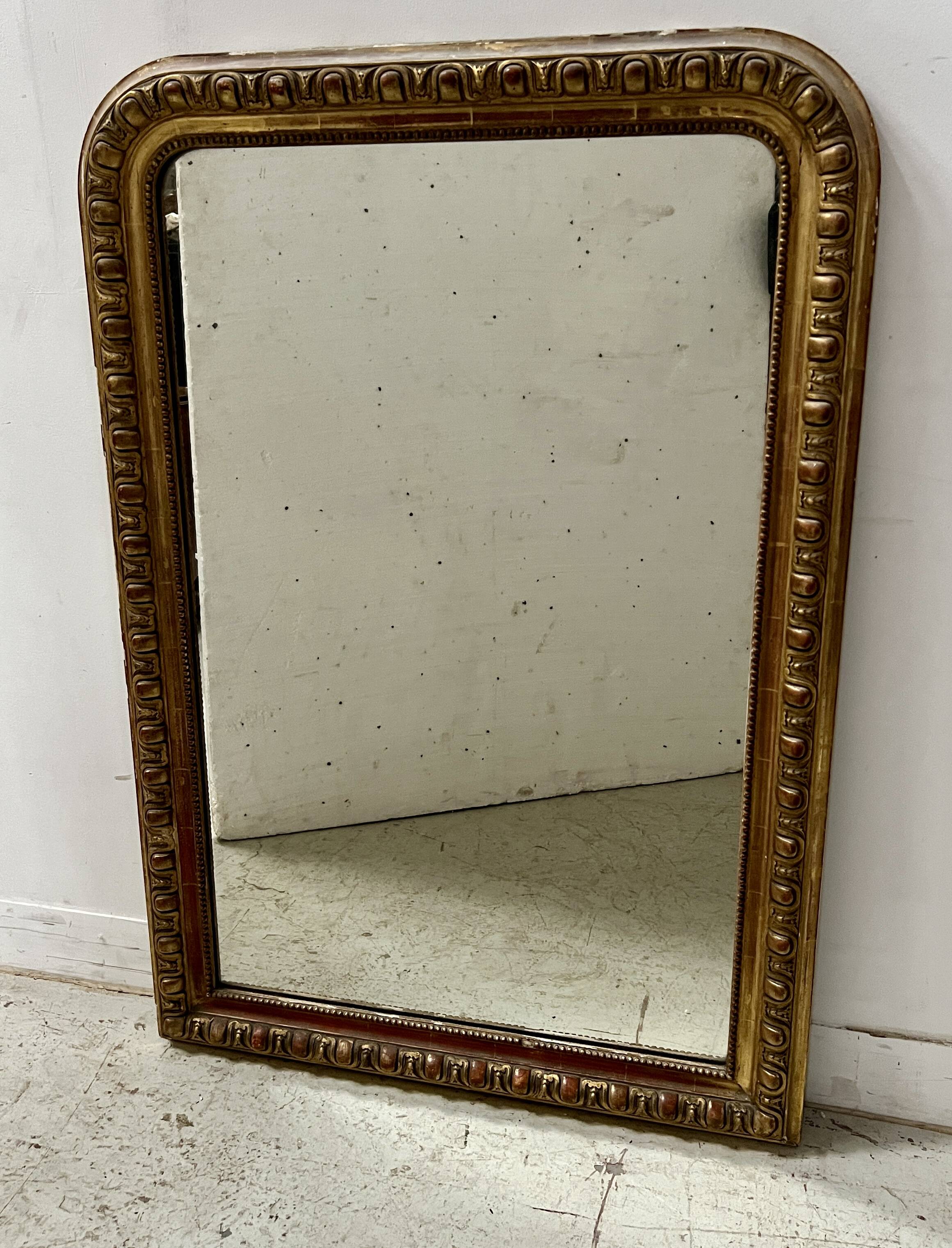 Louis Philippe gadrooned mirror in wood and gilt stucco, 19th century