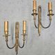 Pair of Louis XVI style bronze wall sconces with bow and tassel, 1940s.