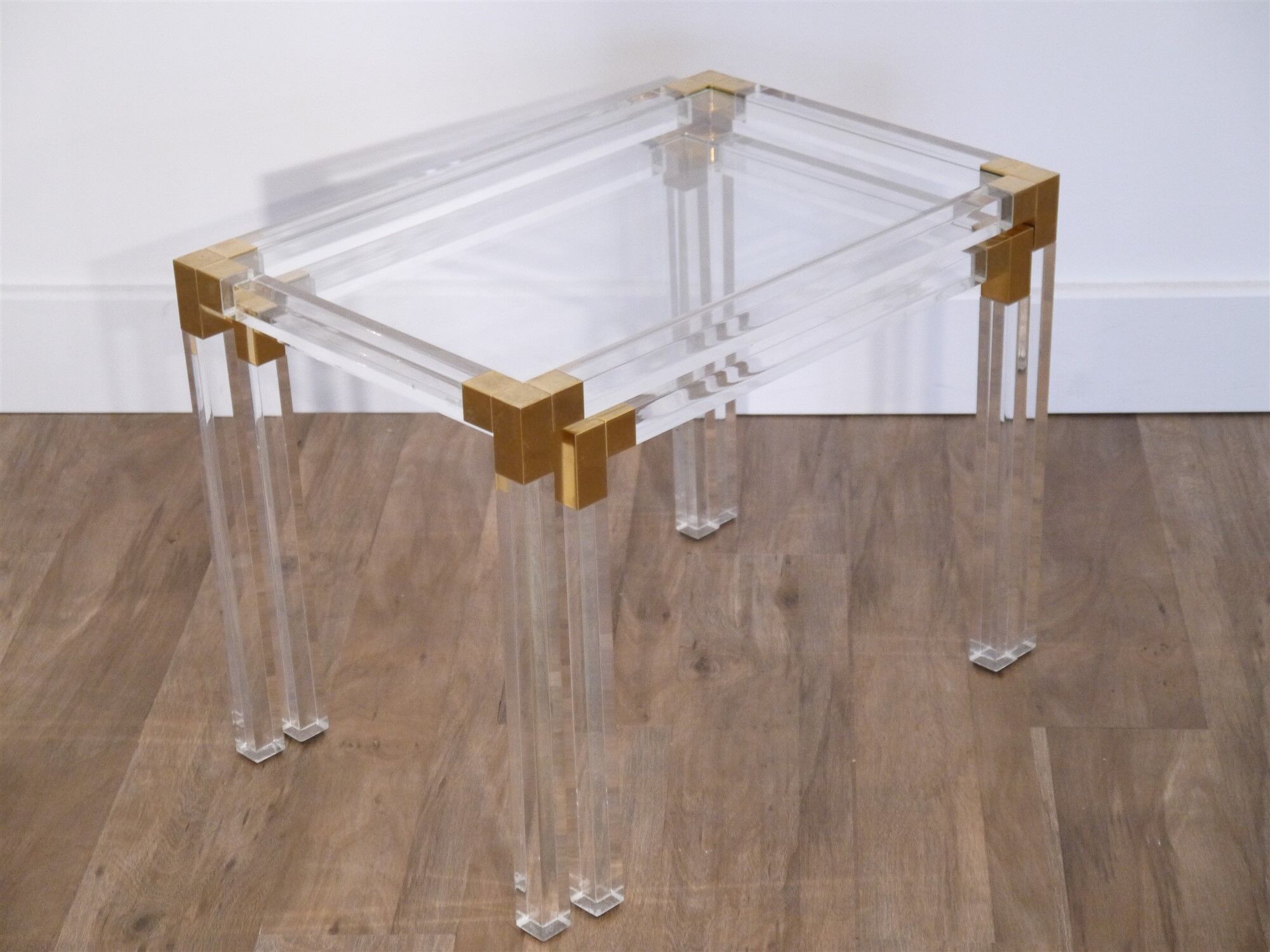 Nesting tables from the 1970s in brass, glass and lucite