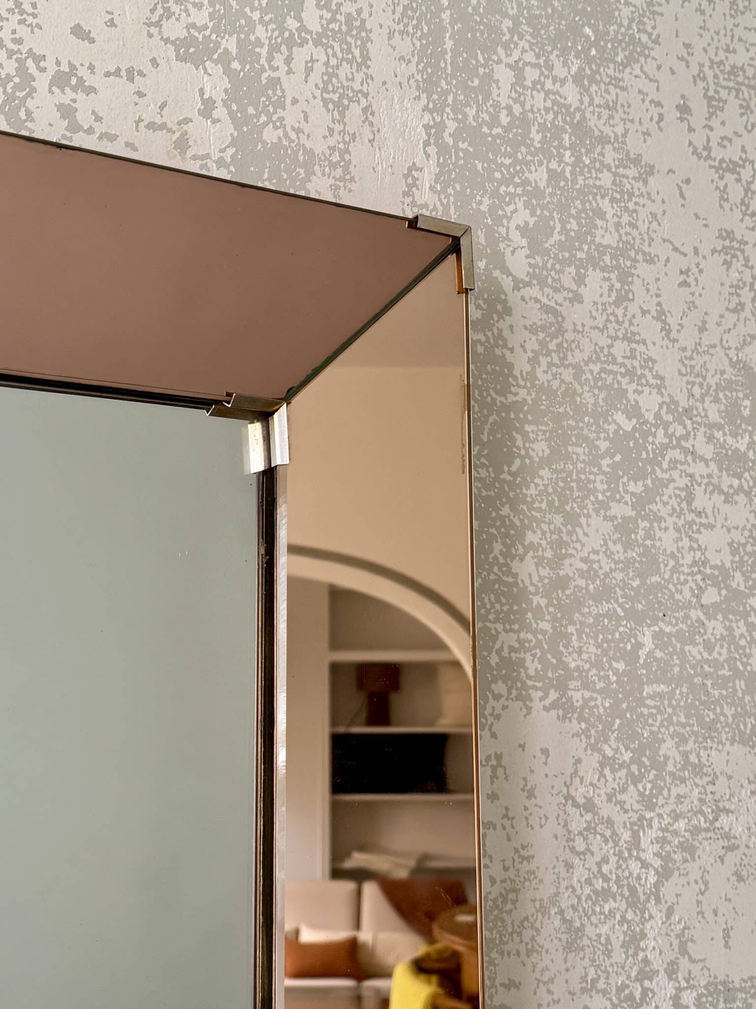 Faceted mirror with rose-coloured frame – Italy, 1980s