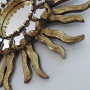 Golden wooden sun mirror with inlays from the early 20th century.