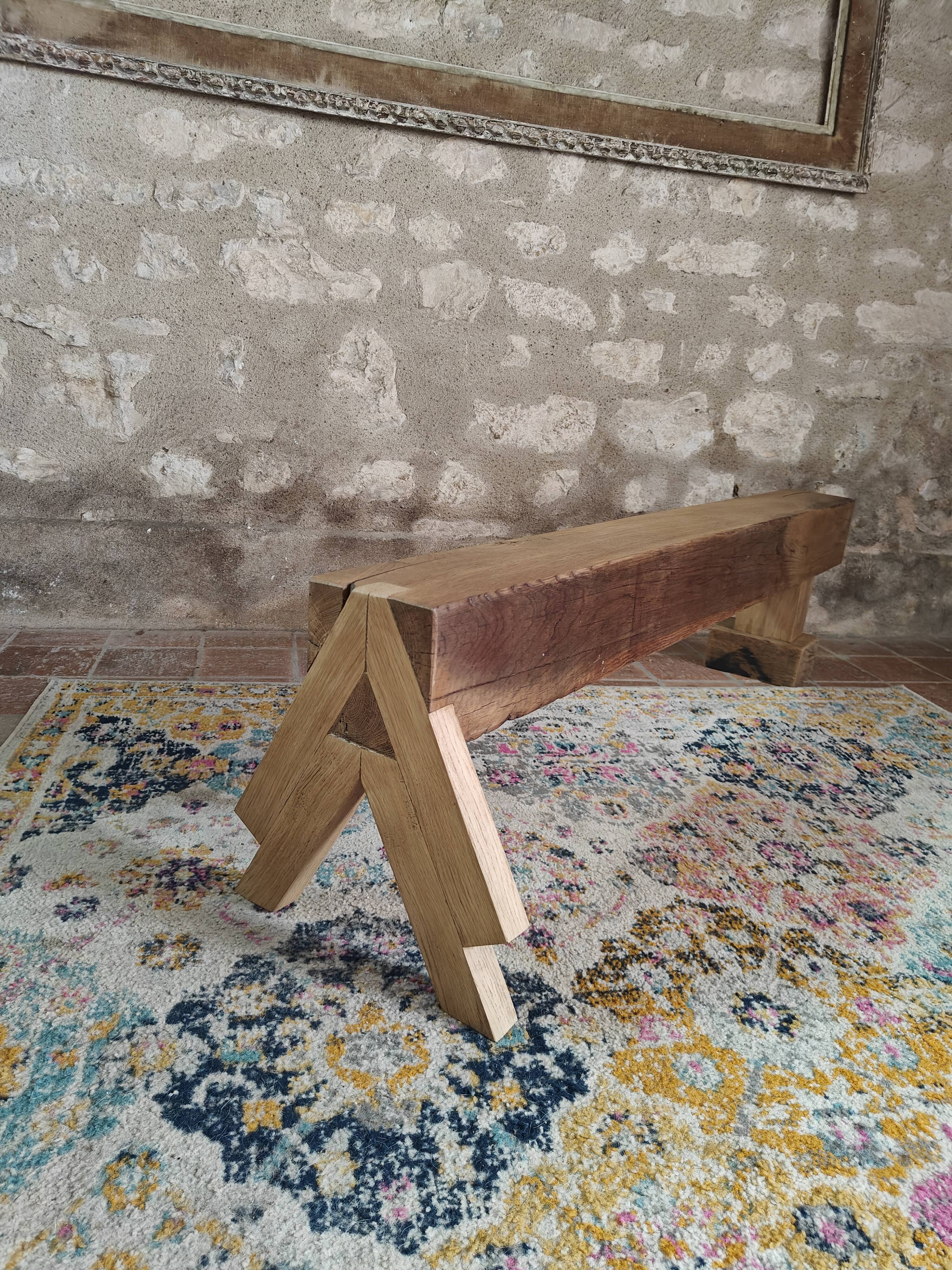 Solid oak bench with asymmetrical legs