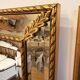 Miroir ancien biseauté doré style Louis XVI