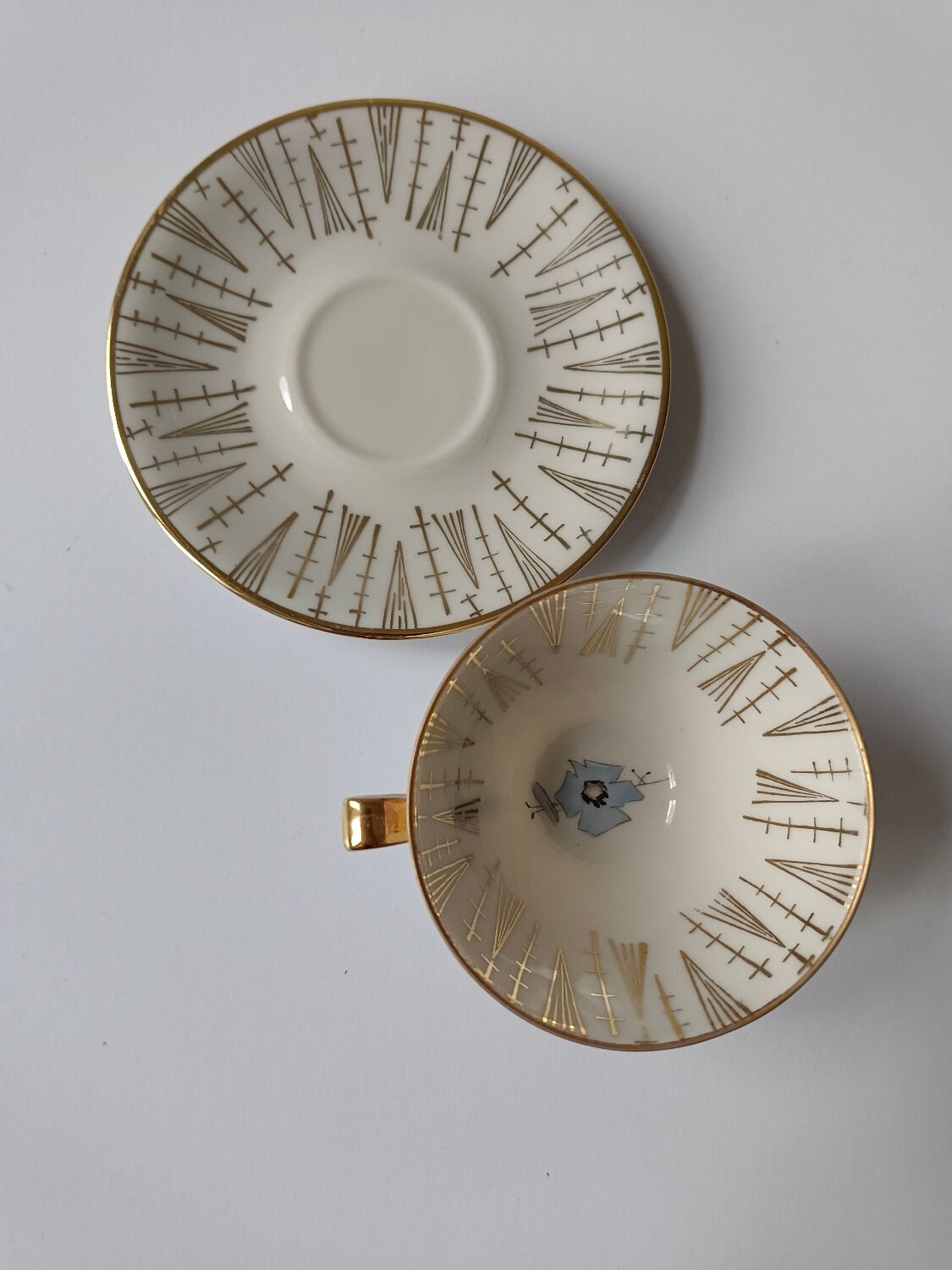 Set of mismatched fine porcelain cups signed with saucer