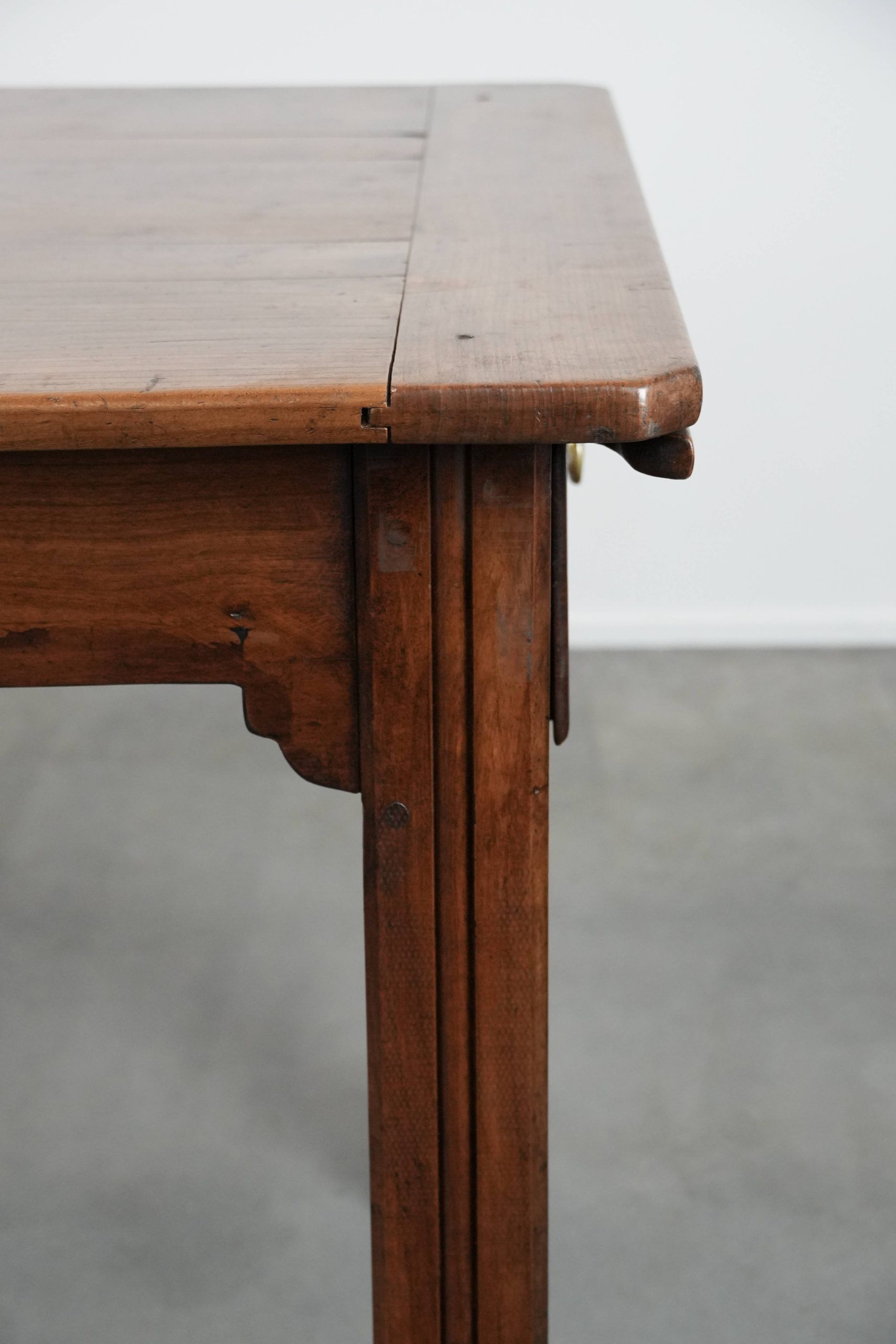 Antique French farmhouse dining table with two drawers and a pull-out board