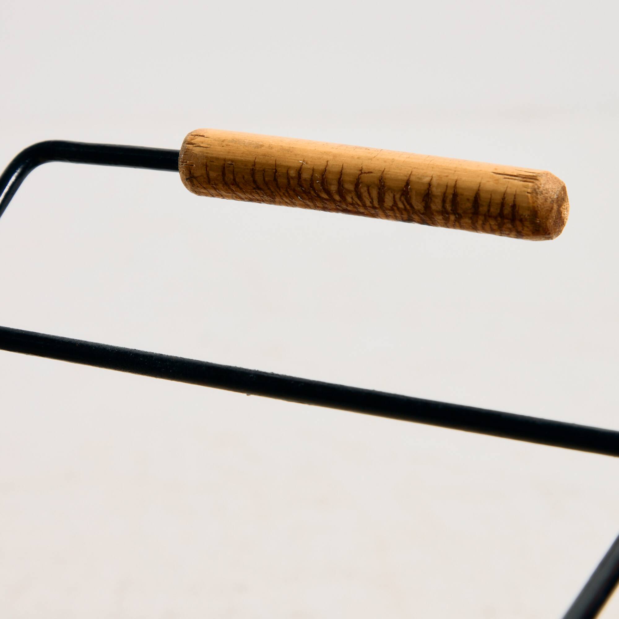 Metal cart with bamboo and wicker details.