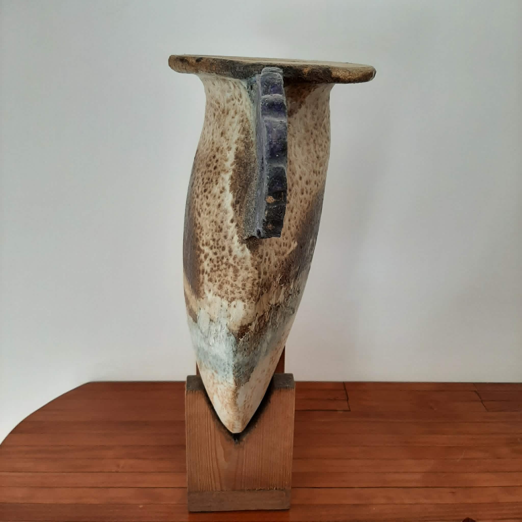 Oval/round pottery on base signed