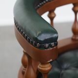 Dark green chesterfield office chair in cowhide leather on wheels