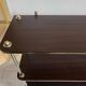 Wooden shelf with gold metal