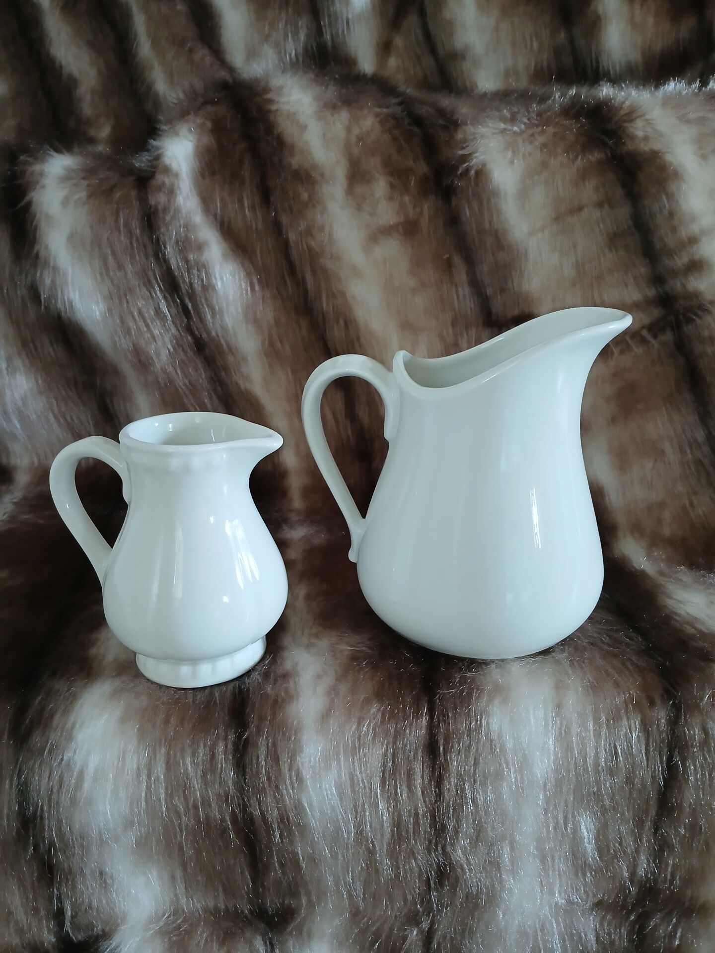 2 antique pitchers in white earthenware