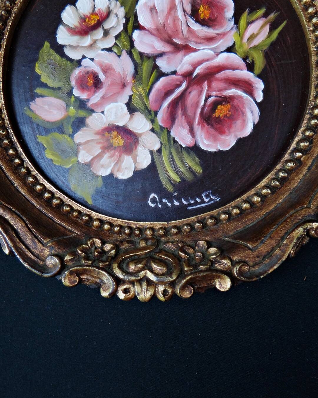 Still life in Tondo oil on panel of a bouquet of pink roses signed