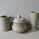 Set of 4 cups, 1 mazagran, 1 milk pot and 1 sugar bowl in pyrity sandstone, signed
