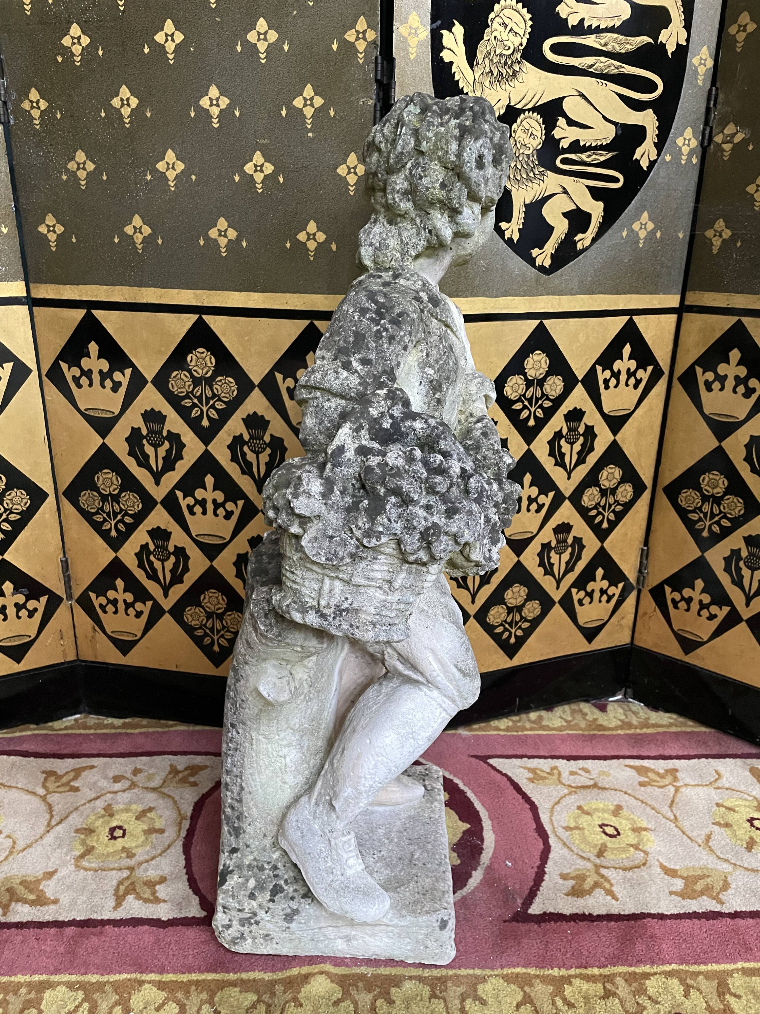 Stone garden statue to the child