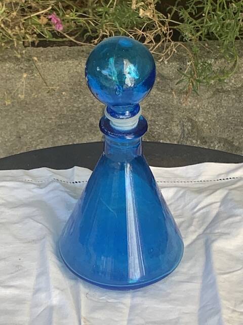 Blue bottle, glass vial for vintage perfume or liqueur.