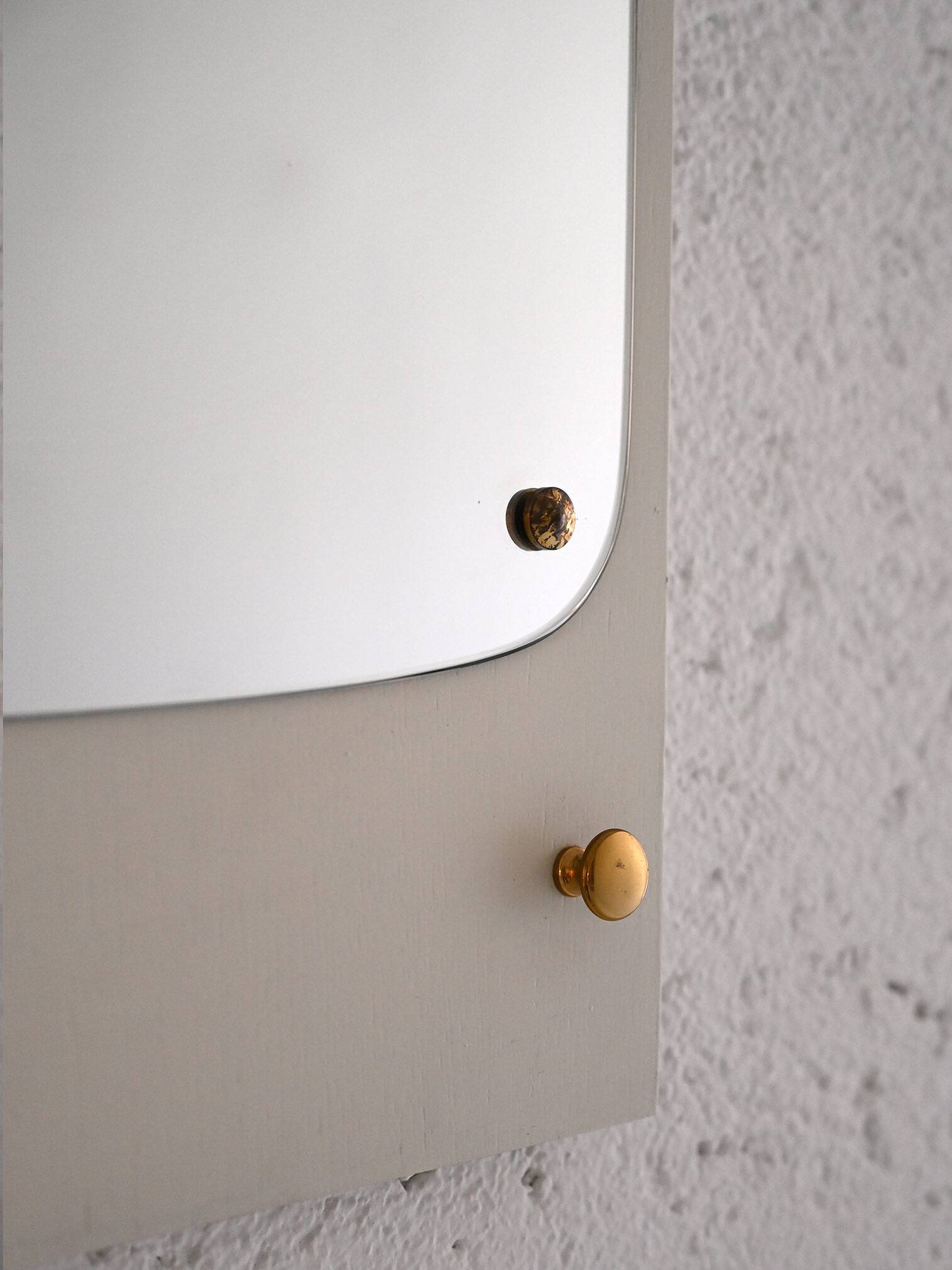 Decorative mirror with white painted wooden frame and gold details