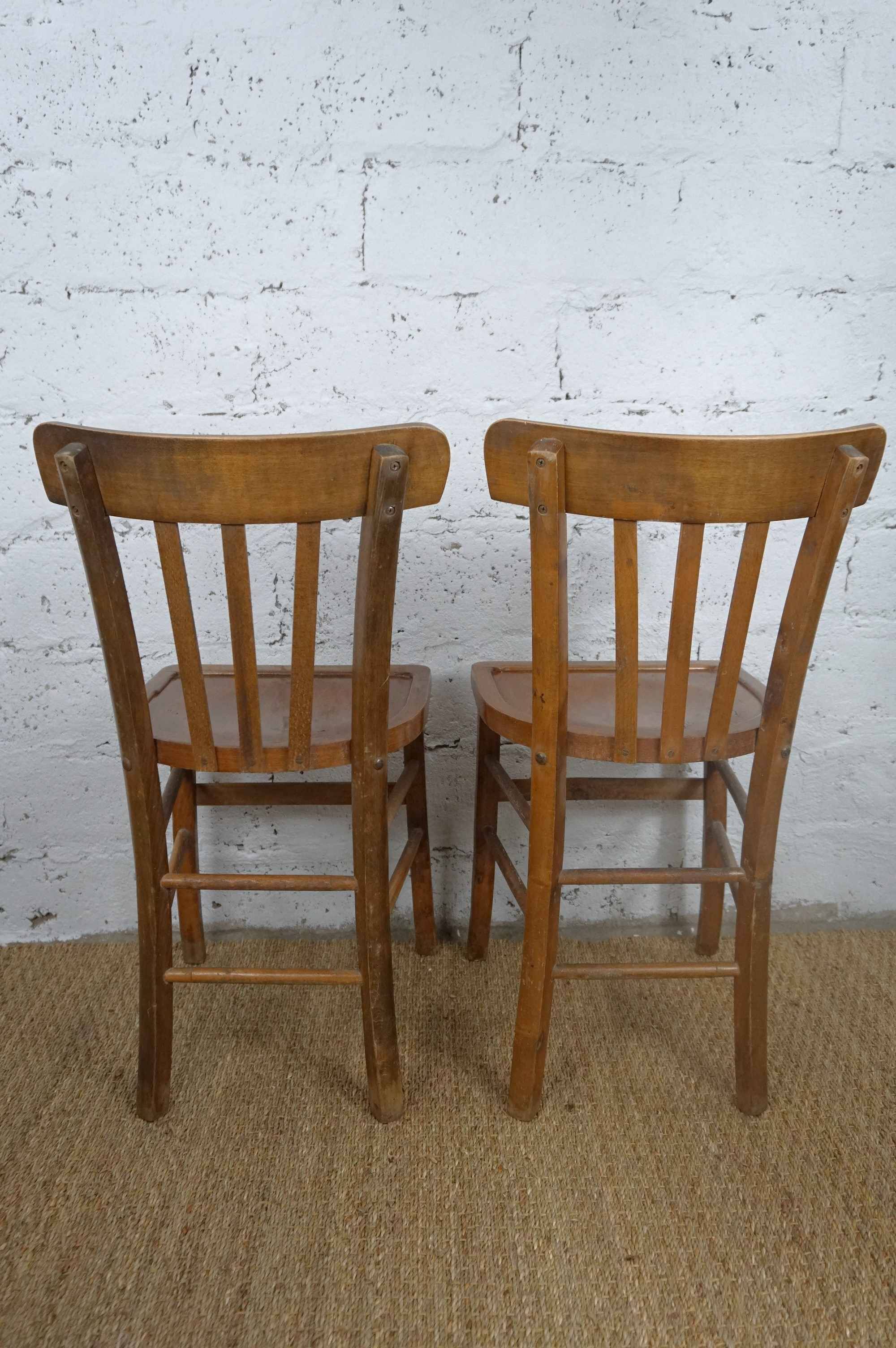 pair of vintage wooden bistro chairs