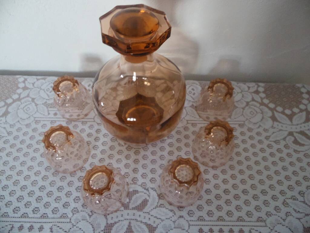 Pink glass liqueur carafe and 6 matching glasses