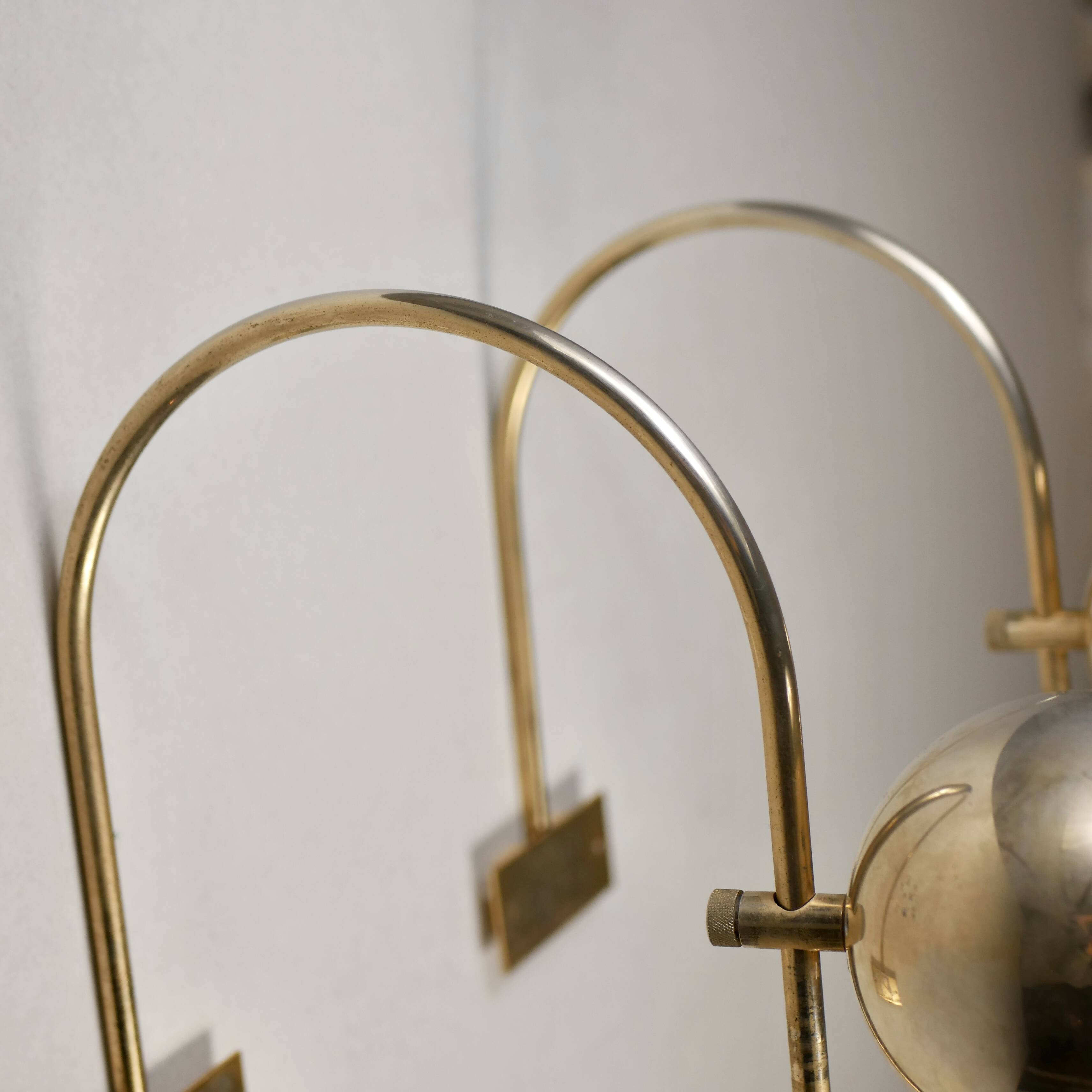 Pair of brass eyeball wall lights