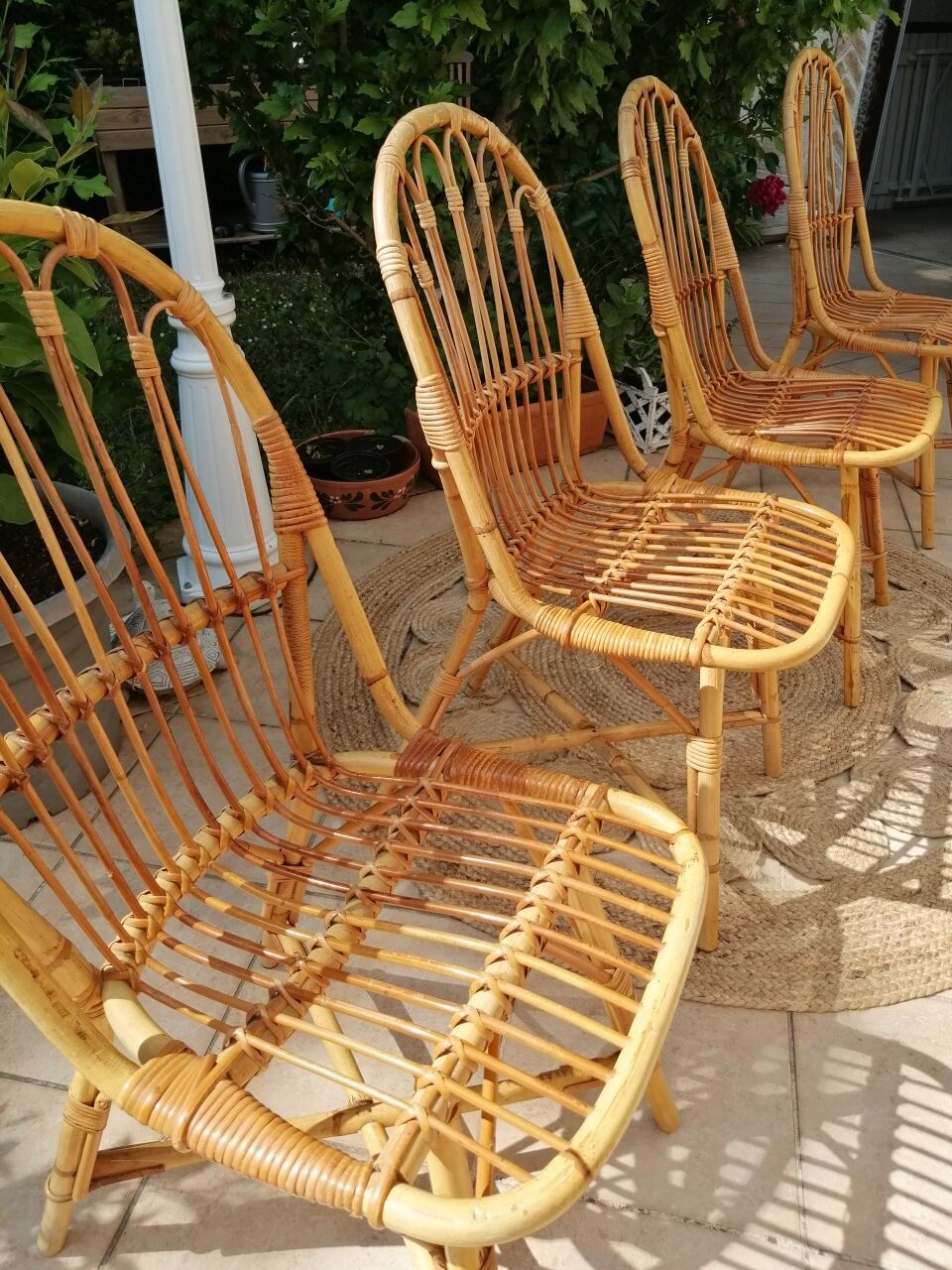 Series of 4 vintage rattan chairs.