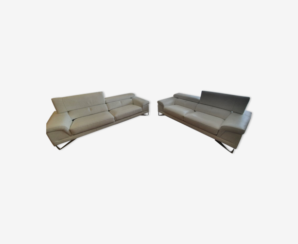 2 white leather sofas