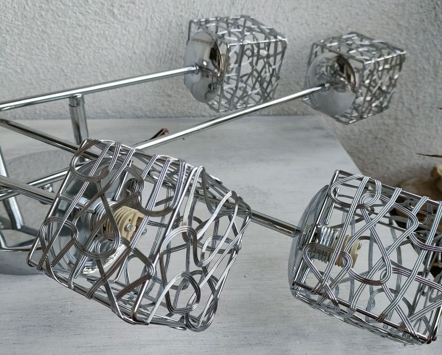 Articulated chromed metal luminaire