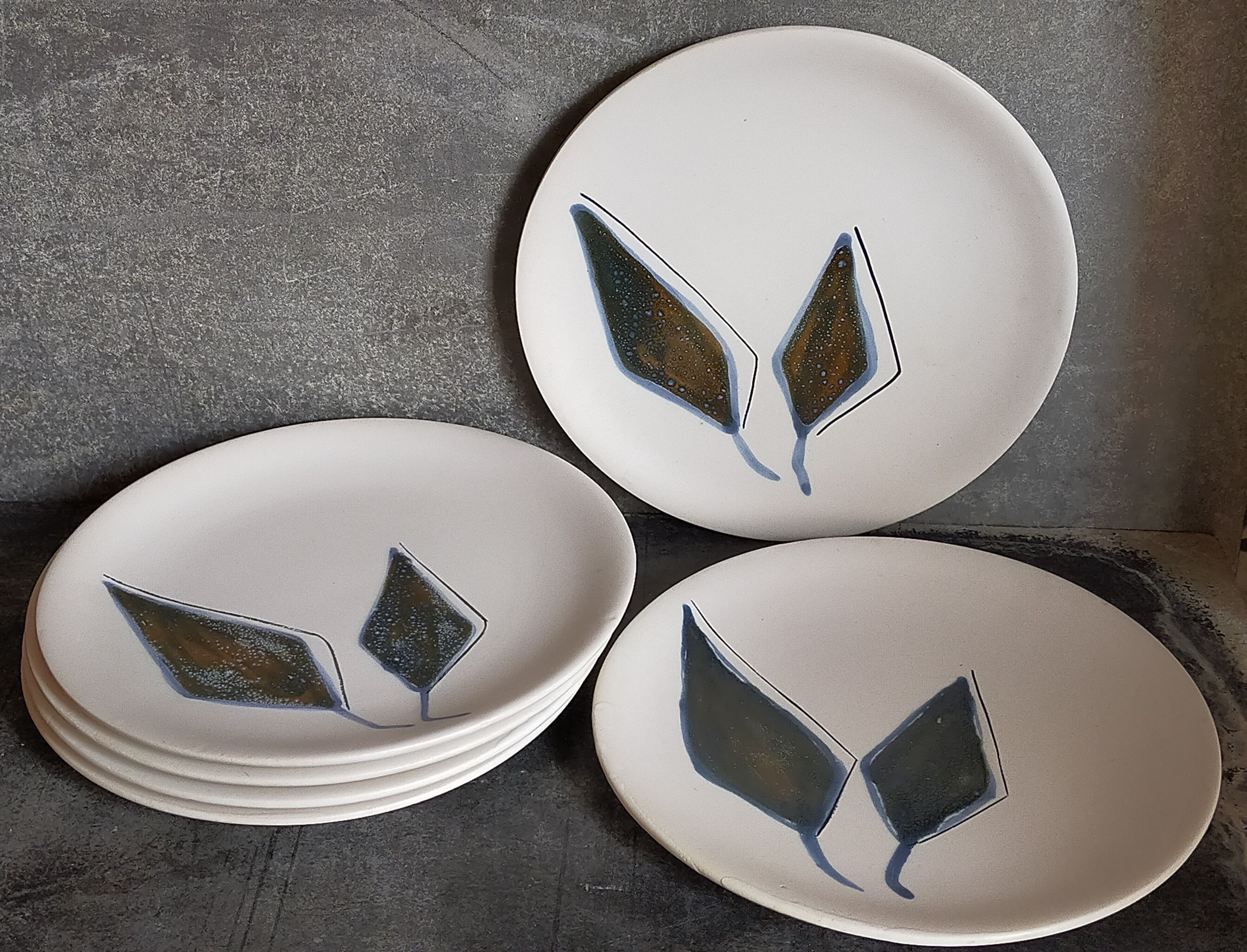 Six ceramic plates with matt enamel 50s