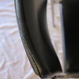 Modernist chair in chromed metal and black imitation leather