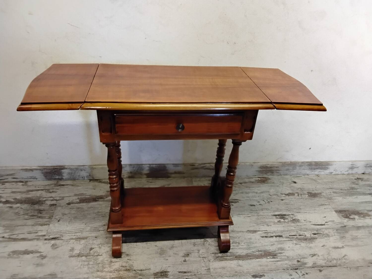 Small wooden drop-leaf table