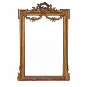 Large mirror in a gold frame, France.