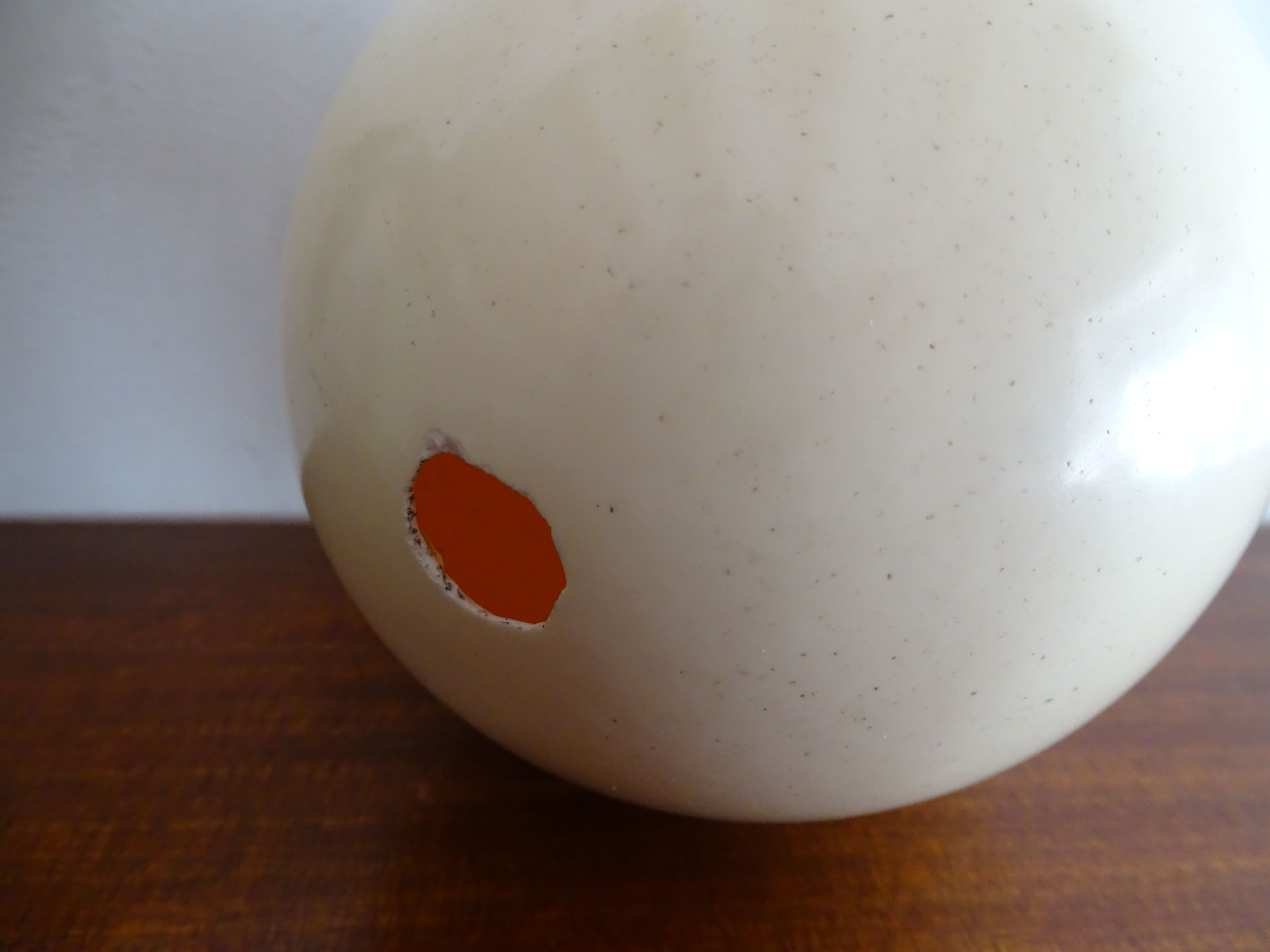 Ostrich egg on blackened wooden base - object of curiosity