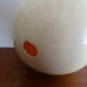 Ostrich egg on blackened wooden base - object of curiosity