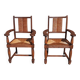 Pair of oak armchairs with straw seats and backs.