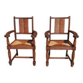Pair of oak armchairs with straw seats and backs.