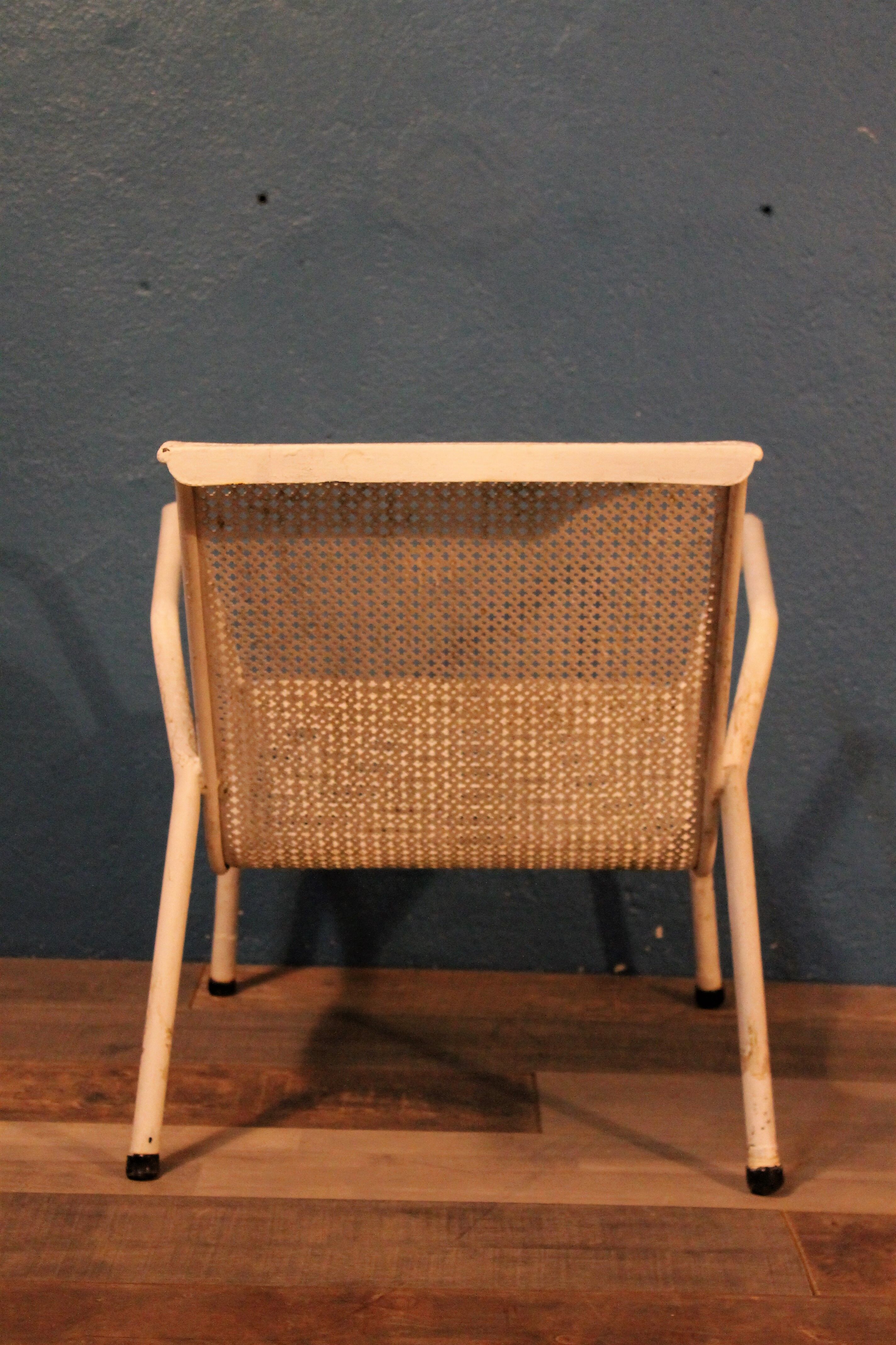 1960 perforated metal garden armchairs
