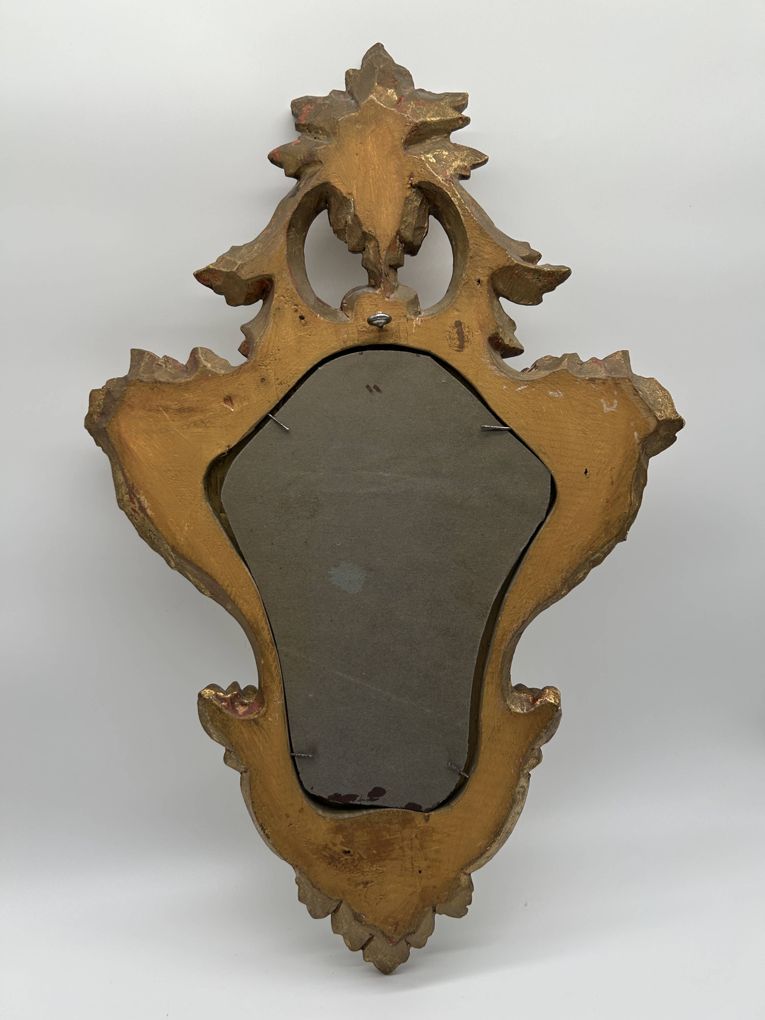 Wooden mirror with gilded stucco