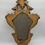 Wooden mirror with gilded stucco