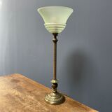 Ornate brass table lamp with mint green glass shade