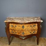 Louis XV style commode with floral marquetry decoration.