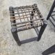 5 blackened wooden stools with woven leather seats by Nina Kaufmann