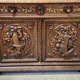 Two-body buffet in solid oak, richly carved in the Renaissance style.