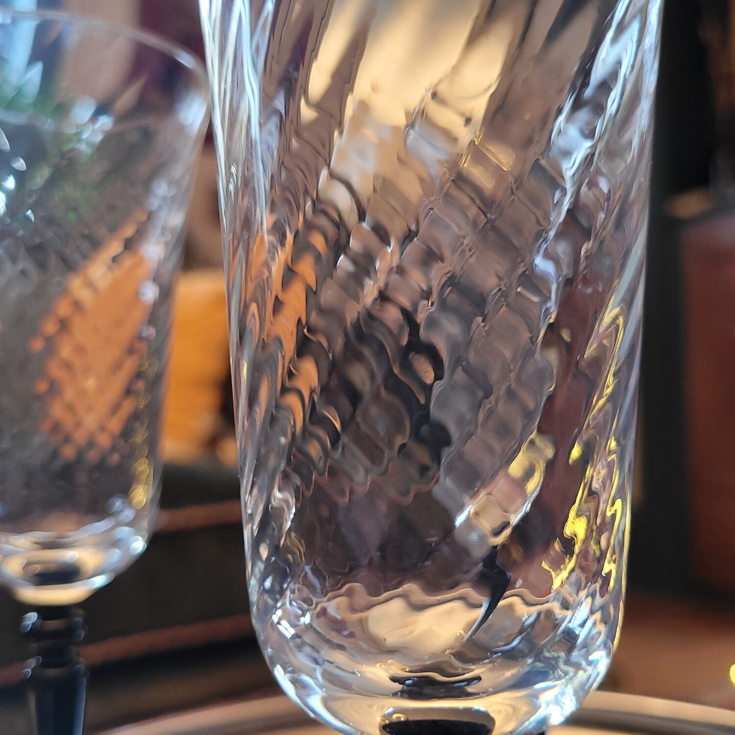 4 clear glass flutes with black stems. 1960–1970. 4 clear glass flutes with black stems.