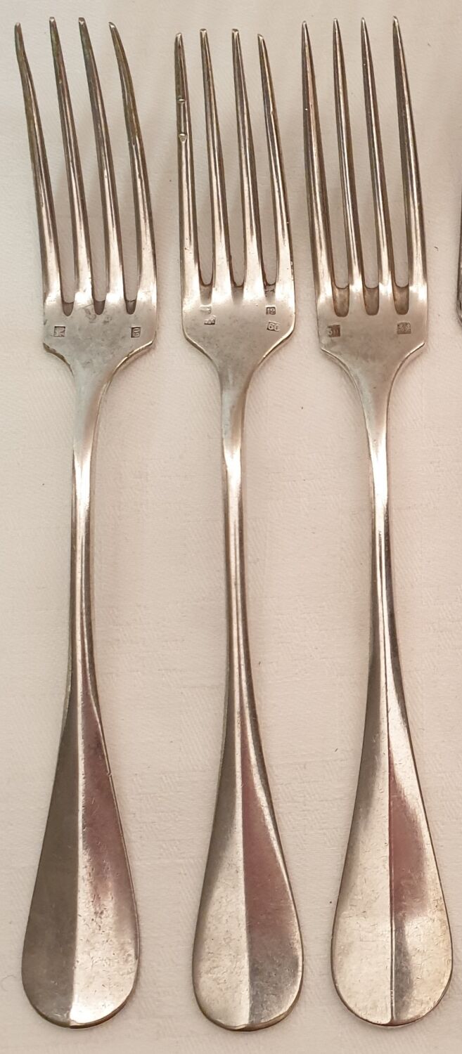 10 mismatched silver metal forks