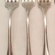 10 mismatched silver metal forks