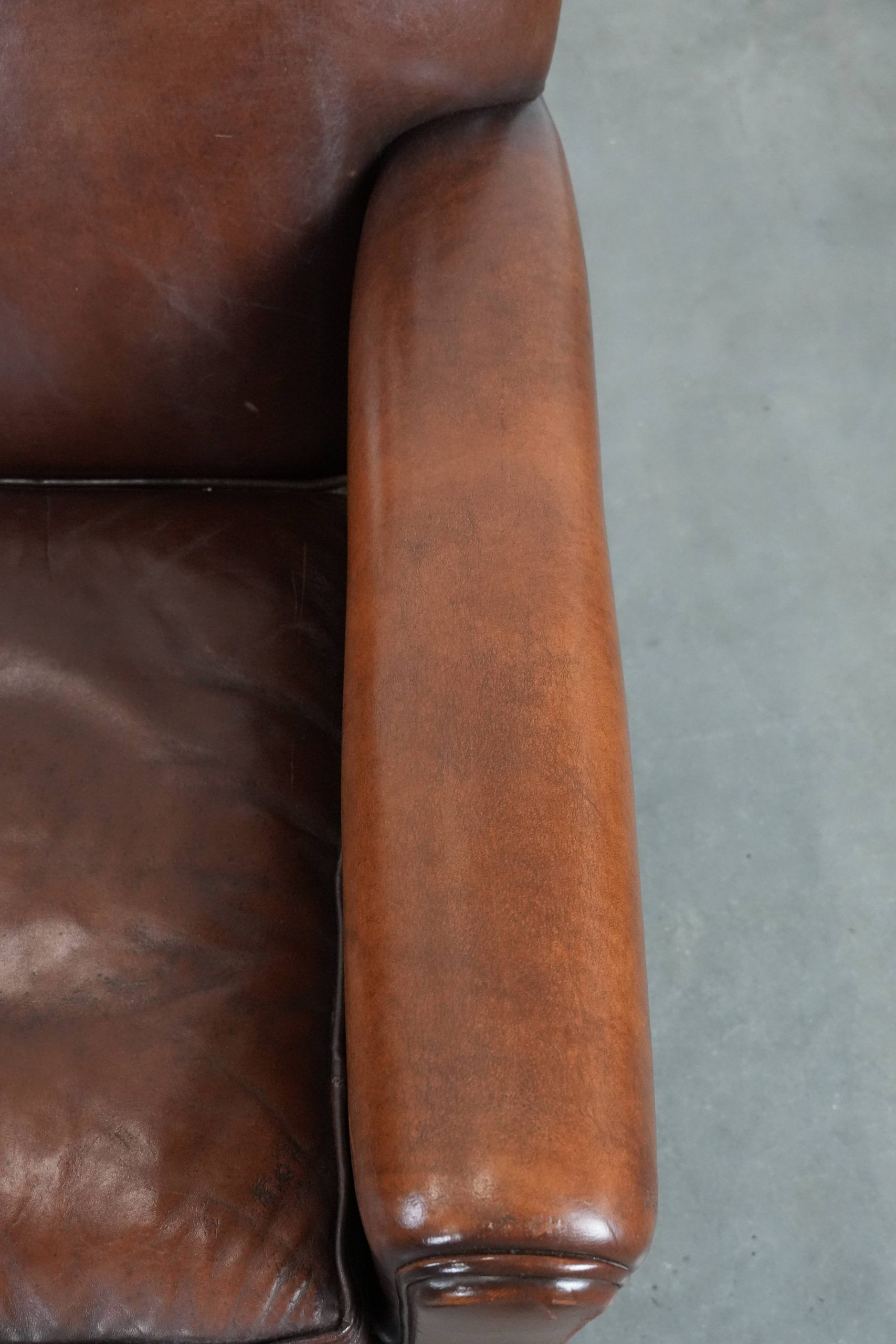 Armchair made of sheepskin leather in art deco design with warm colours