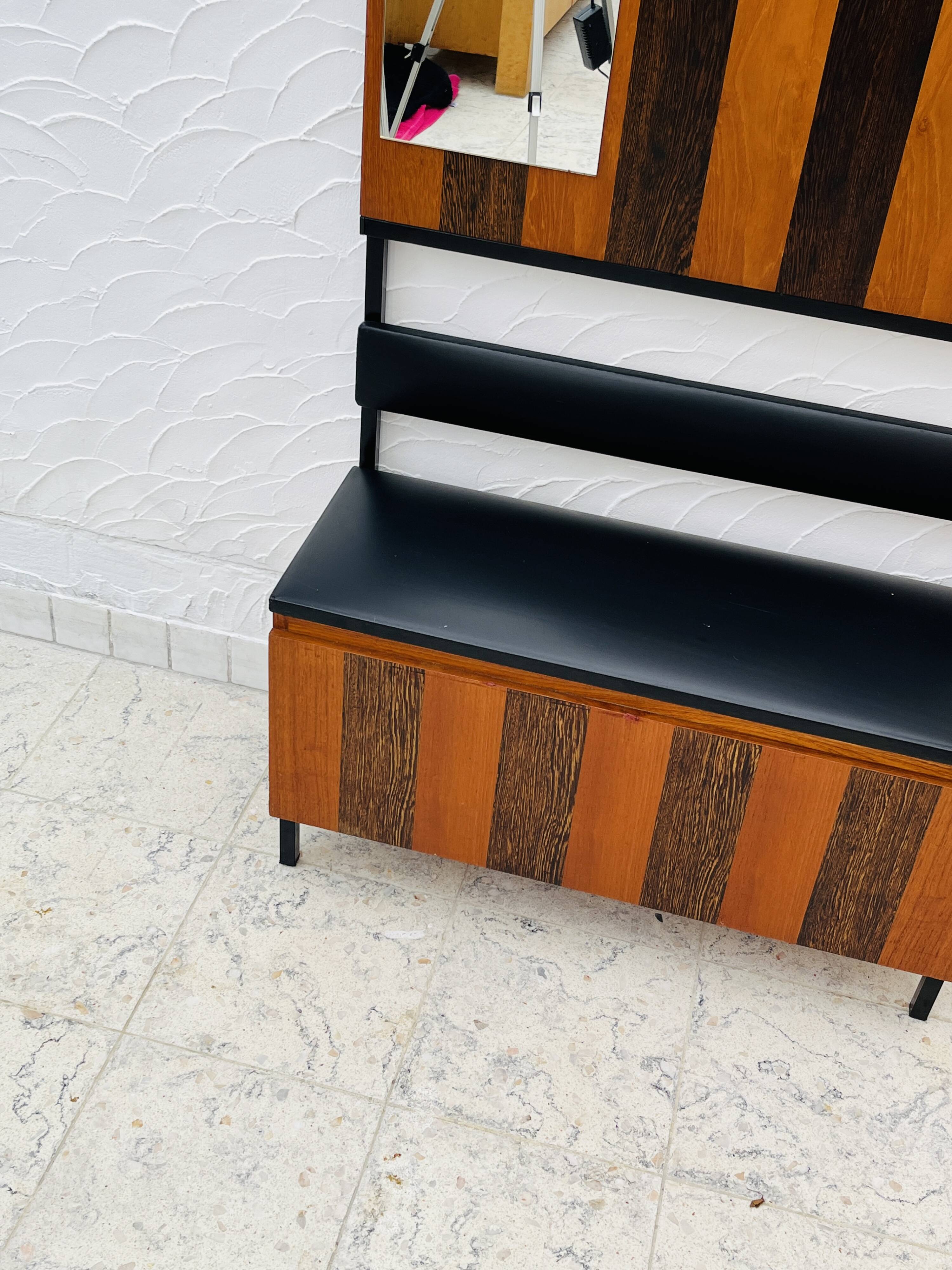 Vintage wall coat rack with storage bench from the 1970s.