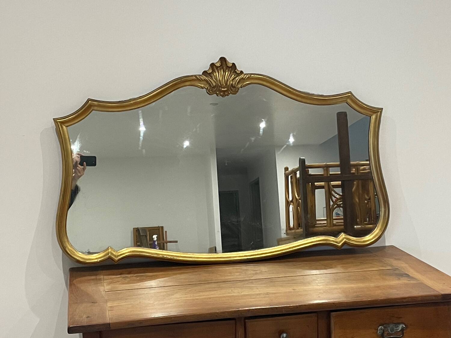 Large vintage mirror with an animated shape and Louis XV baroque style shell